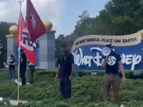 Protesters Fly Nazi And Desantis Flags Outside Disney World Entrance