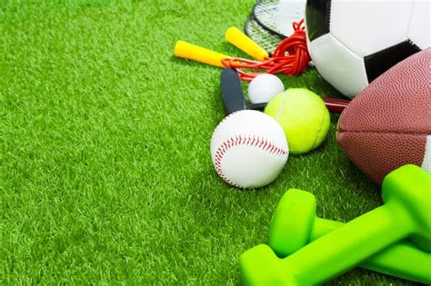 Premium Photo Various Sport Tools And Balls On Grass Top View Background