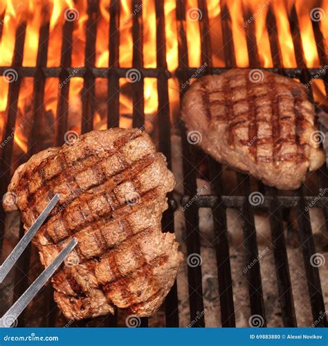 Two Beef Steaks On The Hot BBQ Flaming Grill Stock Photo Image Of Beefsteak Concept