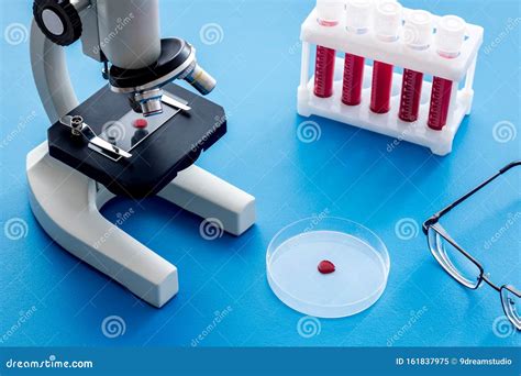 Blood Testing Laboratory Samples Viewing Under Microscope Near Tubes