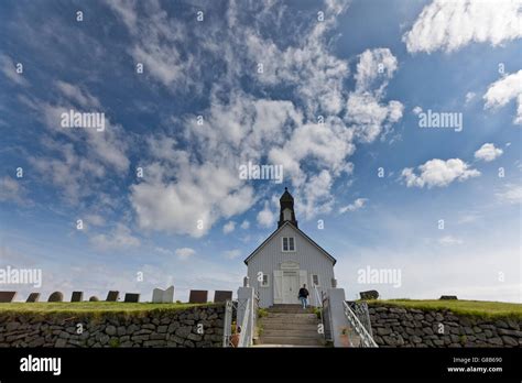 Tourist On The Steps Of Strandakirkja Church Reykjanes Peninsula