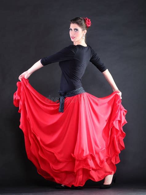 Attractive Spanish Young Woman Dancing Flamenco Over Black Backg Stock