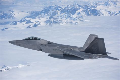 A Us Air Force F 22a Raptor Stealth Fighter Jet Escorts The 176th