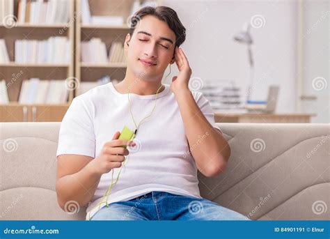 The Man Listening Music Sitting In Couch Stock Image Image Of