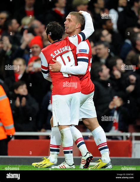 Arsenal S Lukas Podolski Right Celebrates With Team Mate Santi