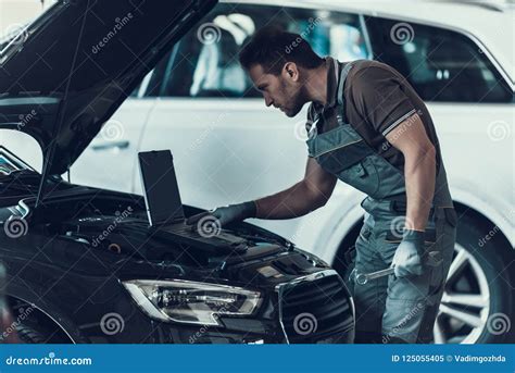 Car Mechanic Working In Auto Repair Shop Stock Image Image Of