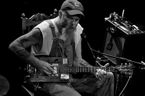 Seasick Steve With A Cigar Box Guitar On Stage