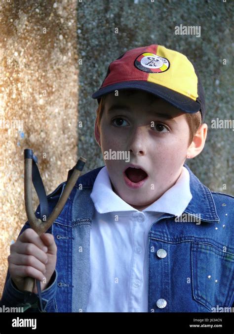 Boy With Slingshot After The Shot Stock Photo Alamy