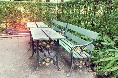 green wooden bench in the garden 11073154 Stock Photo at Vecteezy