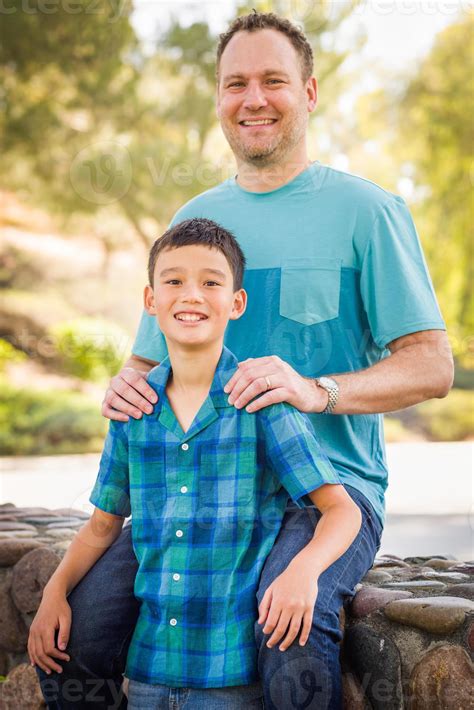 Outdoor Portrait Of Biracial Chinese And Caucasian Father And Son