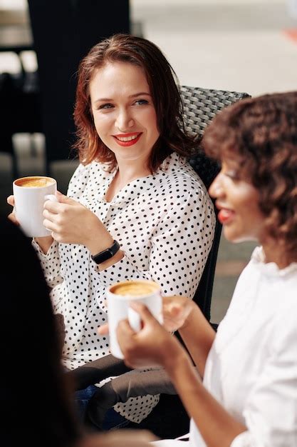 Premium Photo Charming Woman Looking At Talking Friend