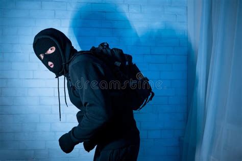 Sneaky Robber Ready To Steal Something At Home Stock Photo Image Of