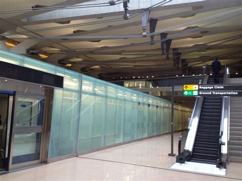 An Escalator And Stairs In A Large Building