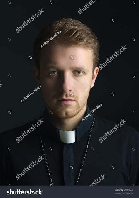 Portrait Of Handsome Catholic Priest Or Pastor With Dog Collar Black