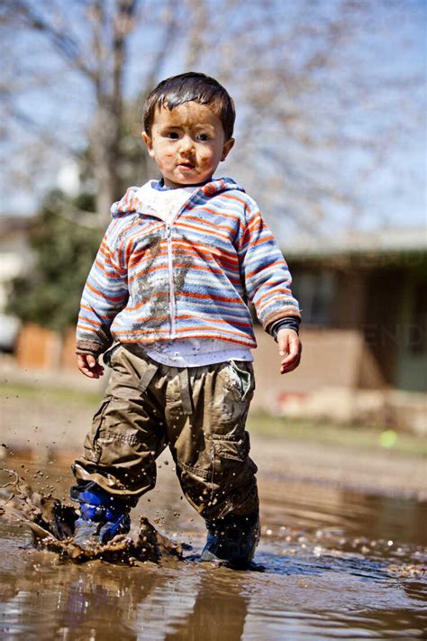 Little Boys Playing In Mud