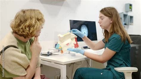 A Otolaryngologist Doctor Explains To A Patient About His Illness At An