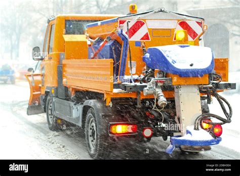 Snow plow truck with salt and grit spreader Stock Photo - Alamy