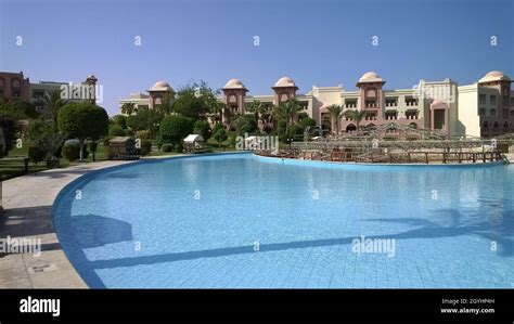 Swimming pool in luxury tropical hotel resort Stock Photo - Alamy