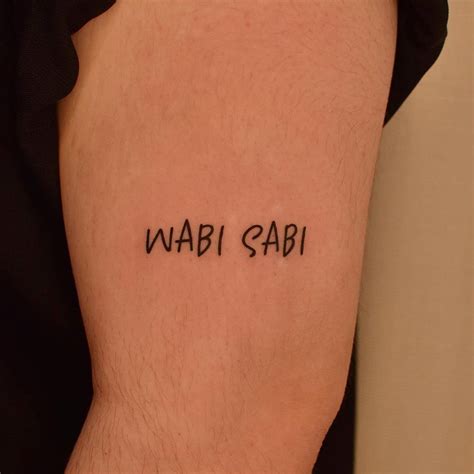 Wabi Sabi Lettering Tattoo Placed On The Upper Arm