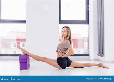 Young Awesome Fit Girl Holding Her Legs On The Pellows And Doing Splits Stock Image Image Of