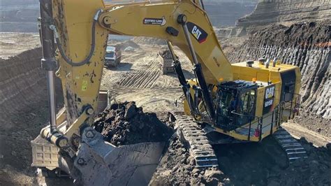 Caterpillar 6015b Excavator Loading Trucks With Two Passes Sotiriadis