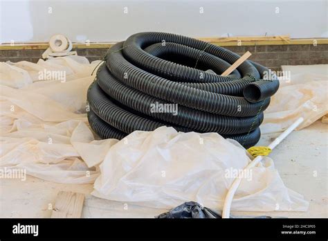 Plastic PVC Pipes Stacked In Rows At A Construction Site On