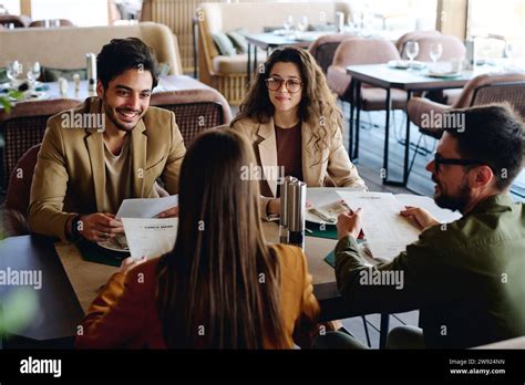 Happy Colleagues Having Lunch Break At Restaurant Stock Photo Alamy