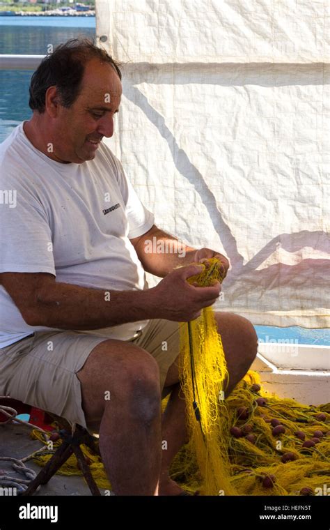 Greek Fisherman Mending Nets Hi Res Stock Photography And Images Alamy