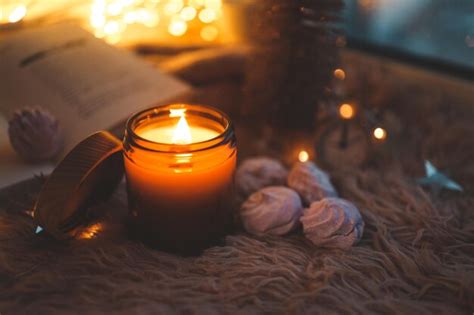 Premium Photo Burning Candle In A Festive Cozy Atmosphere