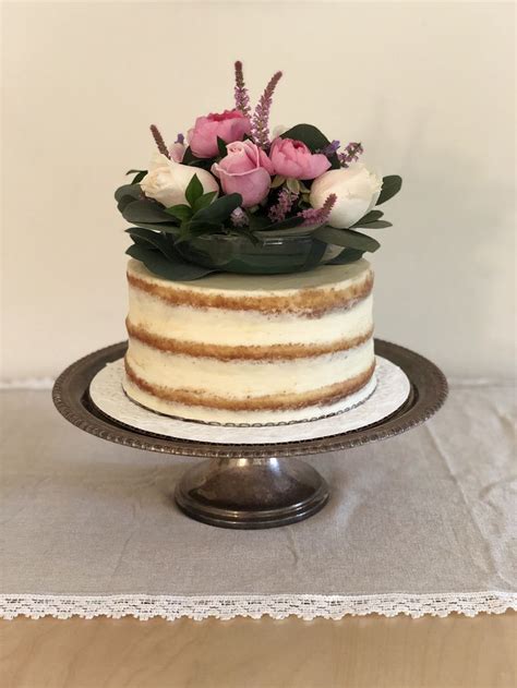 There Is A Cake With Flowers On The Top