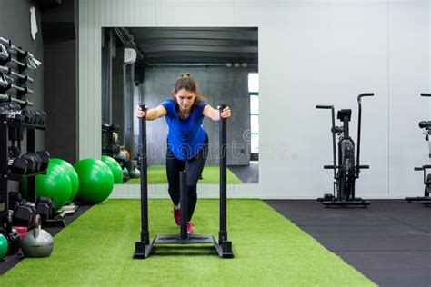 Sled Push Man Pushing Weights Workout Exercise at Gym. Cross Fit Style ...