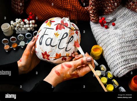 Diy Do It Yourself Woman Paints Thanksgiving Decorations On Orange