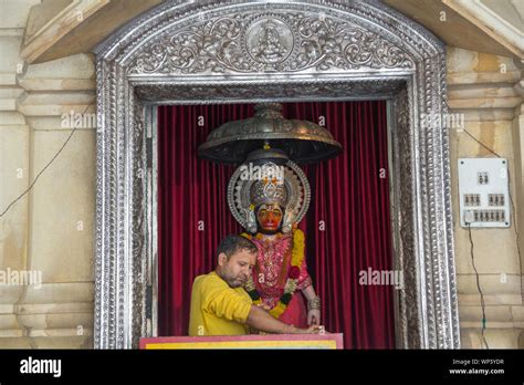 Lord Hanuman Statue And Priest At A Temple Chhatarpur Temple Chhatarpur New Delhi India