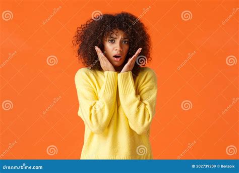 Scared Timid And Insecure Lovely Young Girl With Afro Haircut Yellow