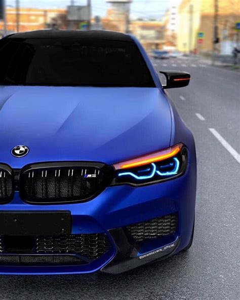 The Front End Of A Blue Bmw Car