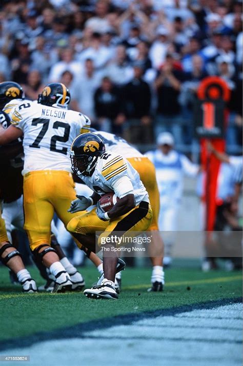 Fred Russell Of The Iowa Hawkeyes Runs With The Ball Against The Penn