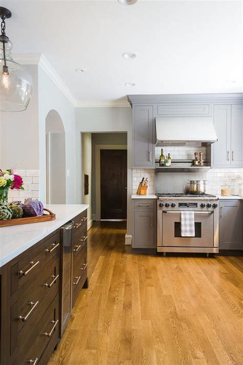 Transform Your Kitchen With Grey Wood Floors And Oak Cabinets The