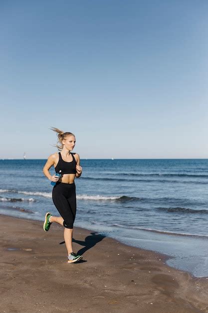 Free Photo | Woman running at the beach