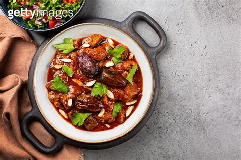 Traditional Moroccan Lamb Tagine Simmered In Spices With Dates And