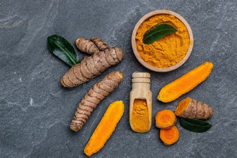 Curcuma Or Curcumin Root Turmeric Powder And Fresh Turmeric On