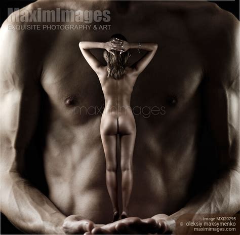 Photo Of Muscular Man Holding Nude Woman In His Hands Stock Image MXI