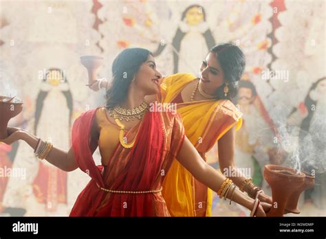 Two Married Bengali Women Performing Dhunuchi Dance On The Occasion Of