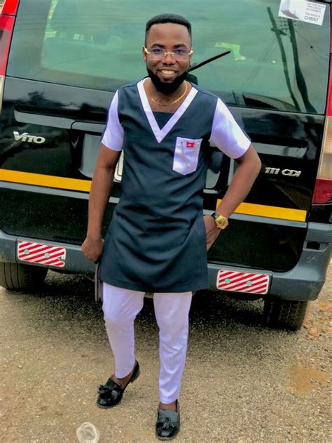 A Man Standing In Front Of A Van