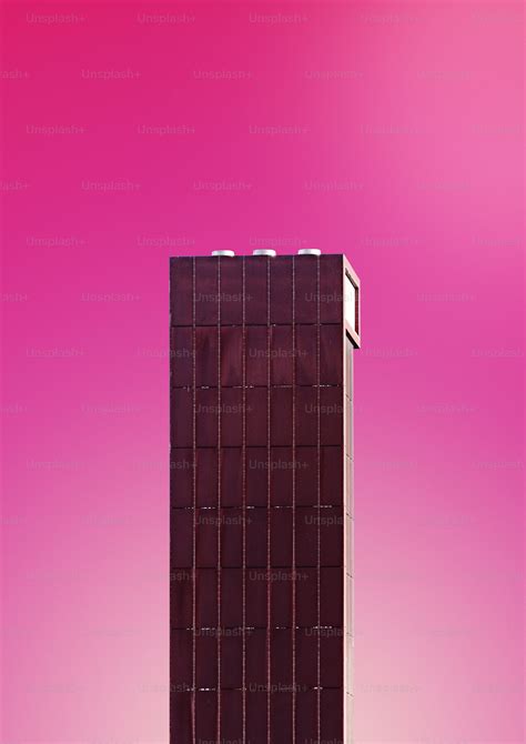 A Very Tall Building With A Sky In The Background Photo Architectural