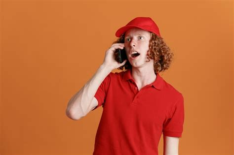 Free Photo Delivery Man Employee In Red Cap Blank Tshirt Uniform