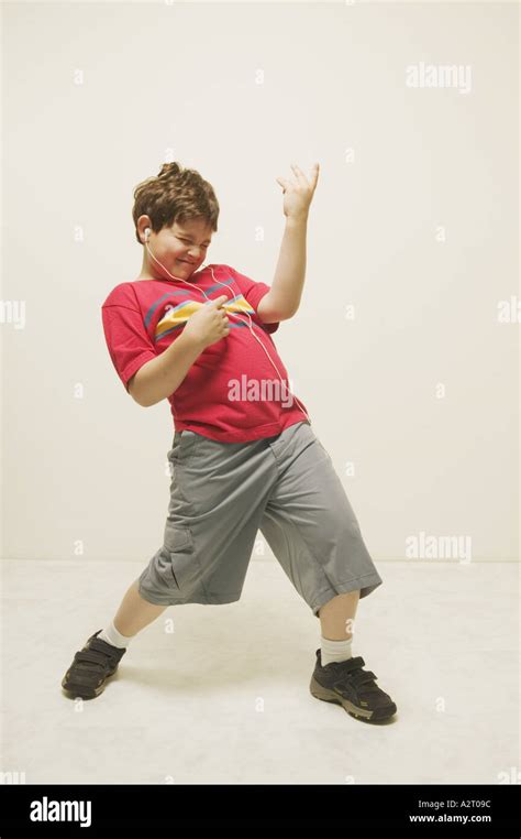 A Boy Playing The Air Guitar Stock Photo Alamy