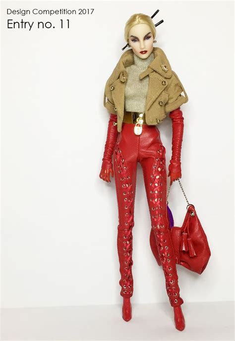 A Barbie Doll Wearing Red Leather Pants And Boots Holding A Handbag In Her Right Hand