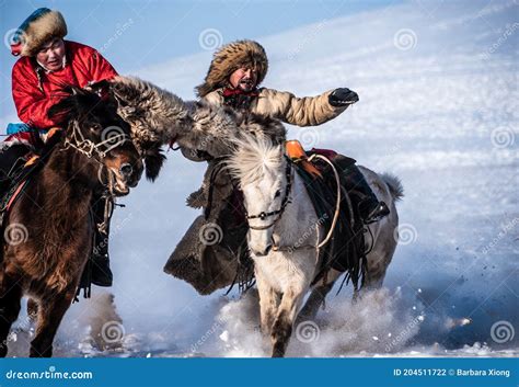 Mongolian Cowboy in Traditional Costumes Riding Wild Horses on the Ice Editorial Photography ...