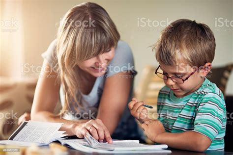 Mother Homeschooling Her Son Stock Photo Download Image Now Istock