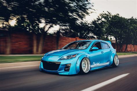 Extremely Exotic Clinched Body Kit On Blue Mazda 3 CARiD Gallery